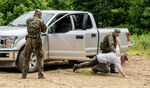 Members of the Polish Territorial Defense Forces receive training in checkpoint vehicle clearing techniques from members of West Virginia Army National Guard (WVARNG) Special Forces during Ridge Runner 19-02, June 24, 2019, in West Virginia. Ridge Runner is a WVARNG training program that provides various National Guard, active duty, and North Atlantic Treaty Organization (NATO) ally nation armed forces with training in irregular and asymmetrical warfare tactics and operations. Photo was altered for security reasons.