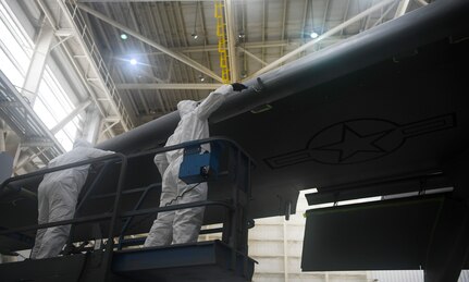 Airman 1st Class Austin Plaugher and Senior Airman Spencer Coole, aircraft structural maintenance technicians from the 437th Maintenance Squadron, prepare to apply the outer coating of aircraft paint to a C-17 Globemaster III July 2, 2019 at Joint Base Charleston, S.C. The technicians at JB Charleston maintain C-17s in support of maintaining a global reach airlift capability. Structural maintenance technicians advise on and maintain the structural and low observable repair, modification and corrosion protection treatment of various types of aircraft.
