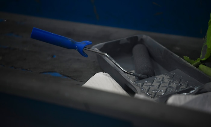 A paint brush is prepped to apply the outer coating of aircraft paint to a C-17 Globemaster III July 2, 2019 at Joint Base Charleston, S.C. The technicians at JB Charleston maintain C-17s in support of maintaining a global reach airlift capability. Structural maintenance technicians advise on and maintain the structural and low observable repair, modification and corrosion protection treatment of various types of aircraft.