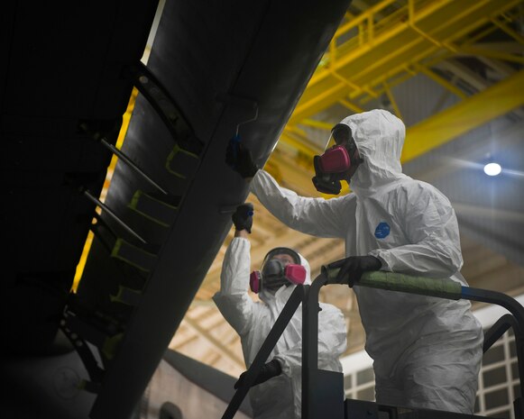 Airman 1st Class Austin Plaugher and Senior Airman Spencer Coole, aircraft structural maintenance technicians from the 437th Maintenance Squadron, prepare to apply the outer coating of aircraft paint to a C-17 Globemaster III July 2, 2019 at Joint Base Charleston, S.C. The technicians at JB Charleston maintain C-17s in support of maintaining a global reach airlift capability. Structural maintenance technicians advise on and maintain the structural and low observable repair, modification and corrosion protection treatment of various types of aircraft.