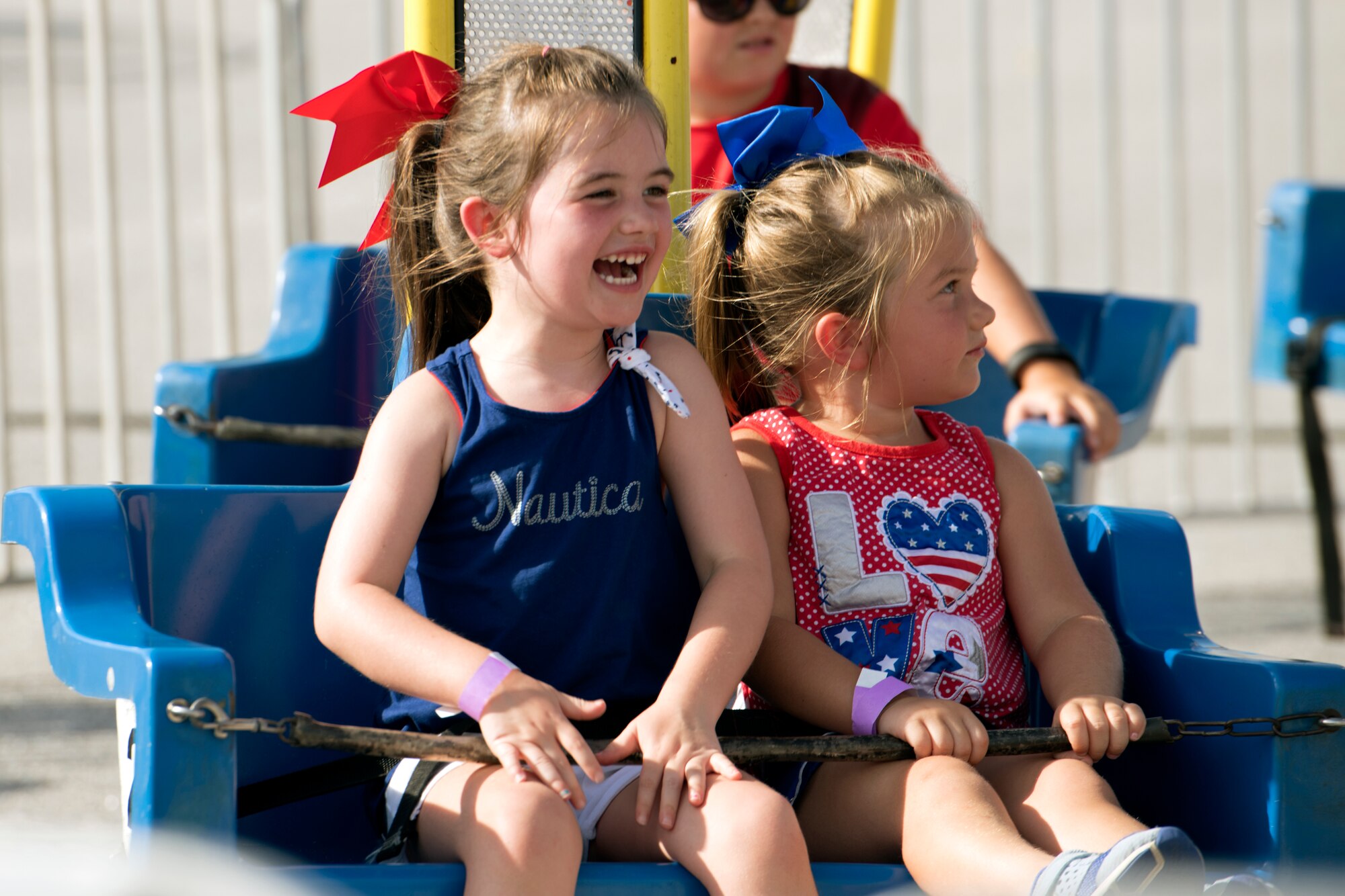 Team Shaw children sit in a ride during the 20th Force Support Squadron Freedom Bash at Shaw Air Force Base, South Carolina, June 29, 2019.