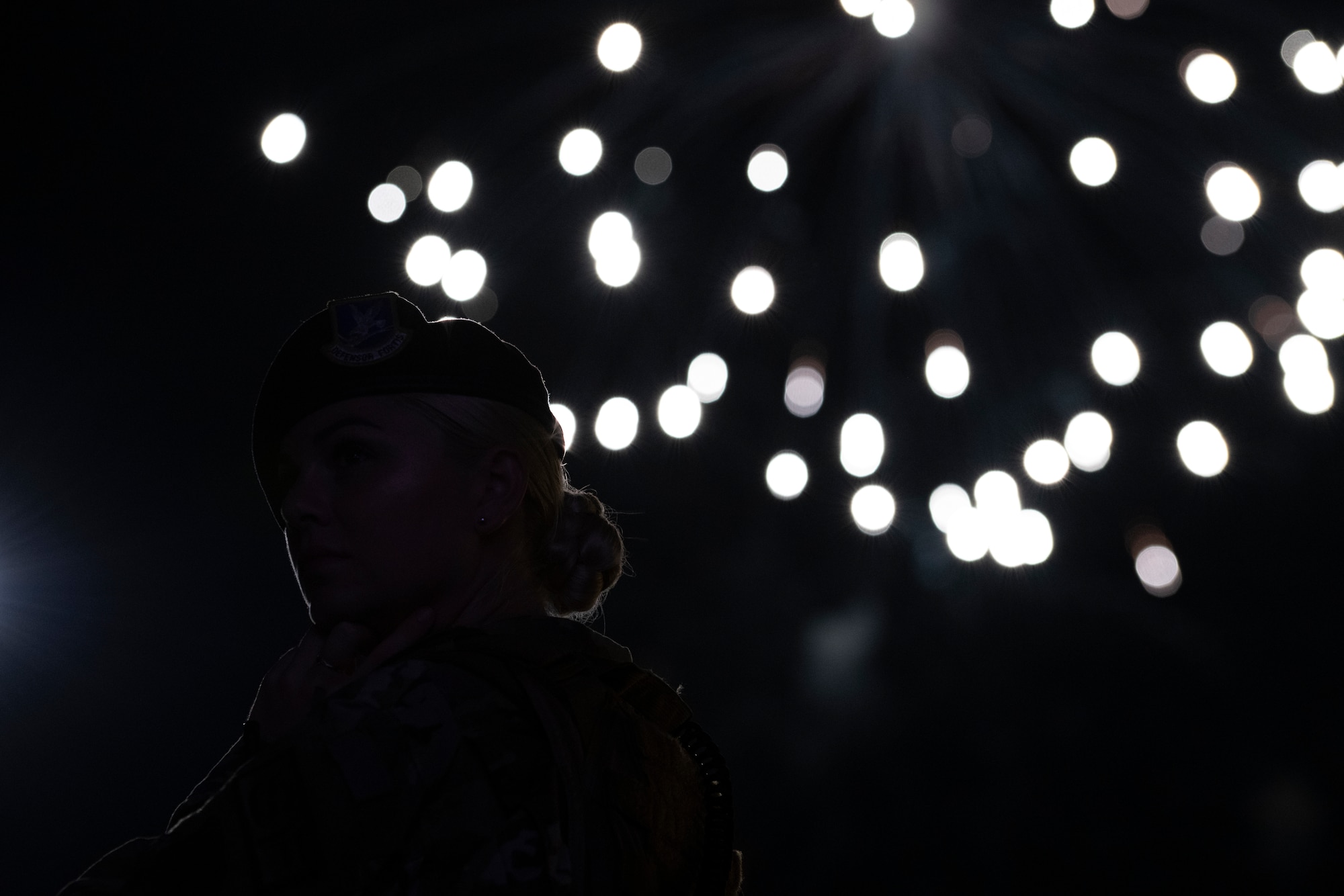 An Airman assigned to the 20th Security Forces Squadron (SFS) turns to look at a crowd during a fireworks display at the 20th Force Support Squadron’s annual Freedom Bash at Shaw Air Force Base, South Carolina, June 29, 2019.