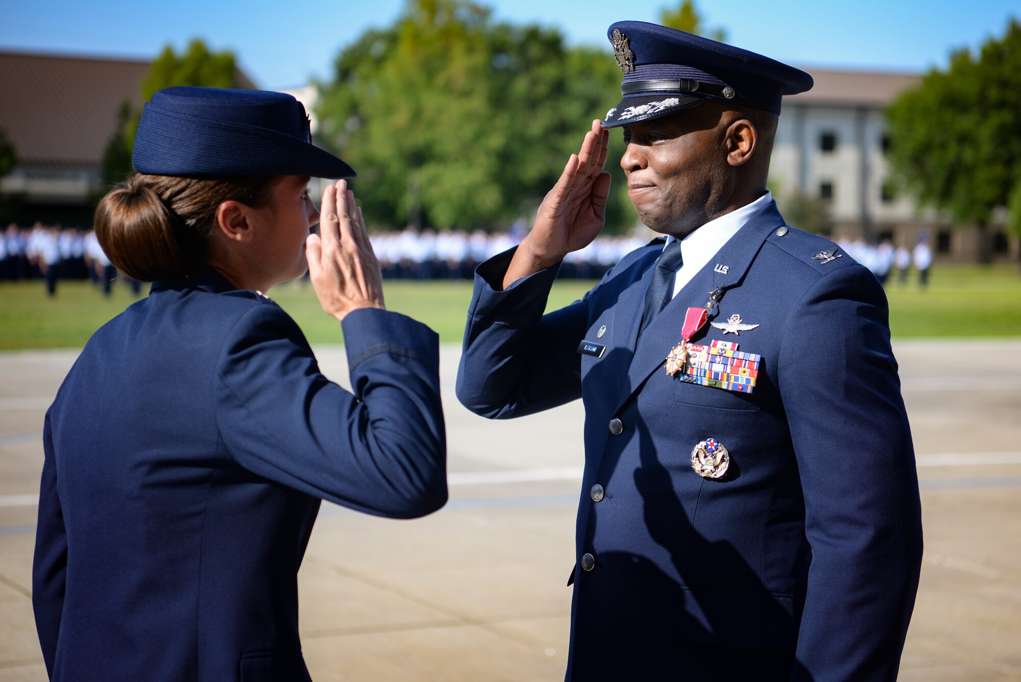 U.S Air Force Col. Leo Lawson Jr., outgoing 81st Training Group commander, salutes Col. Heather Blackwell, 81st Training Wing commander, after receiving the Legion of Merit medal during the 81st TRG change of command ceremony at the Levitow Training Support Facility drill pad on Keesler Air Force Base, Mississippi, July 1, 2019. The ceremony is a symbol of command being exchanged from one commander to the next by the handing-off of a ceremonial guidon. Lawson's next assignment is to United States Transportation Command. (U.S Air Force photo by Airman 1st Class Spencer Tobler)