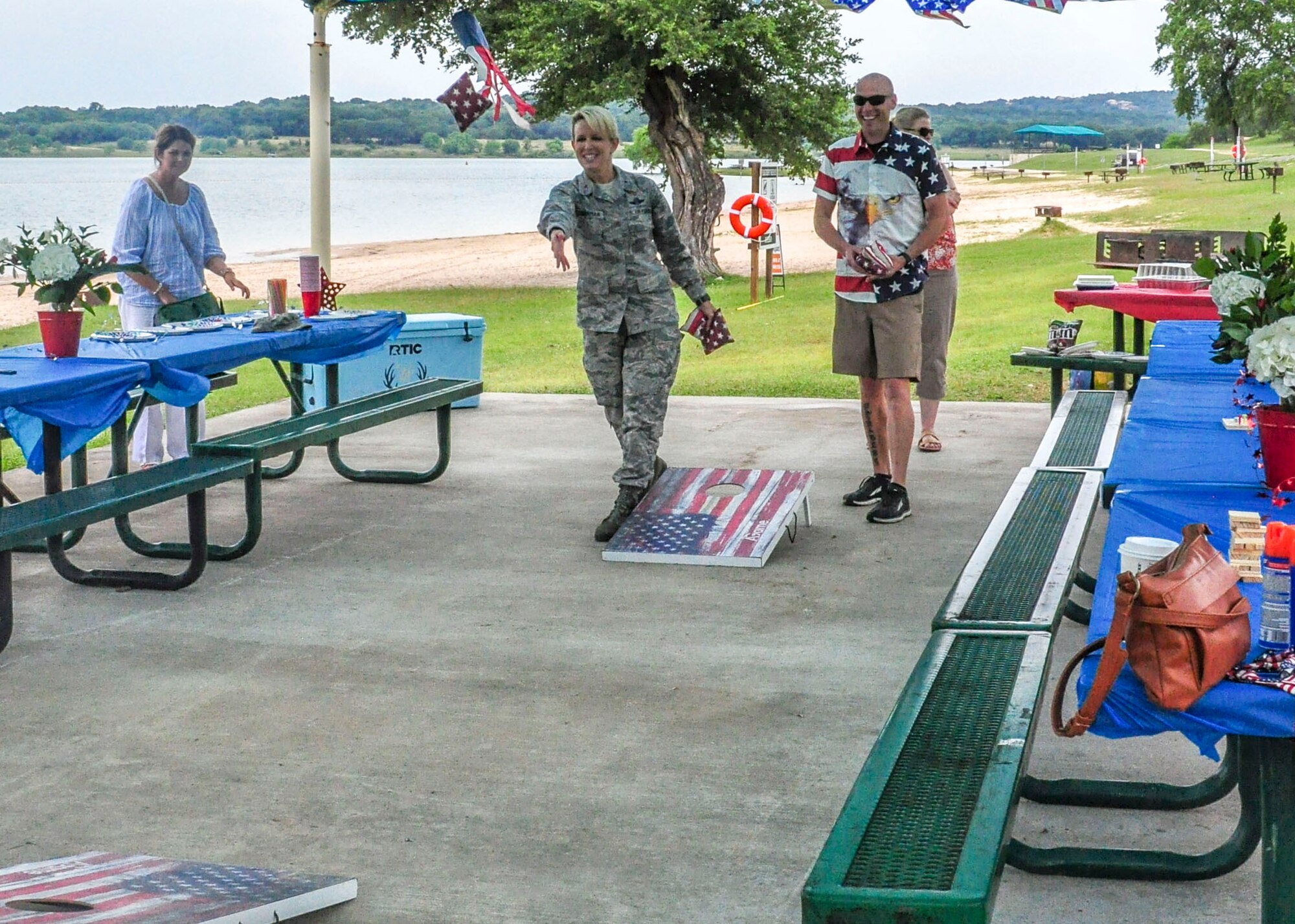 Brig. Gen. Laura Lenderman, 502nd Air Base Wing and Joint Base San Antonio commander and Capt. Nathan Spradley, 502nd ABW commander’s action group, play corn hole during the 502nd ABW command section’s resiliency day at Canyon Lake June 11, 2019. For the 502nd ABW command staff function, the Unite program provided funding for food, $5 per member.
