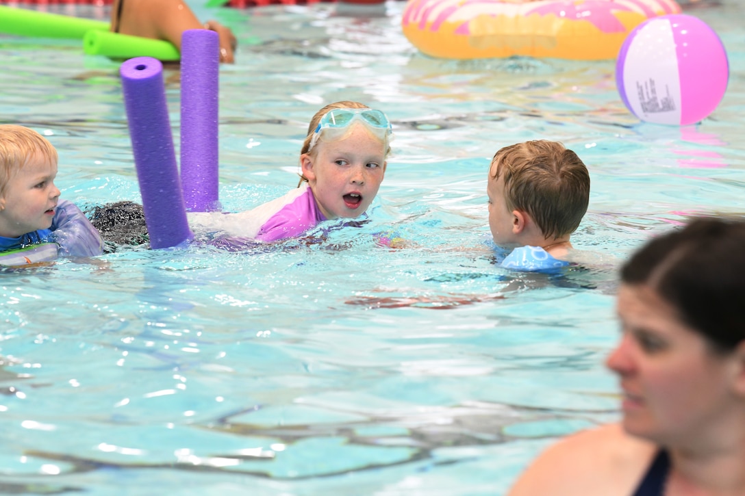 A child swims at the Summer Splash event at Ellsworth Air Force Base, S.D., July 1, 2019. The 28th Force Support Squadron hosted a pool party at the Bellamy Fitness Center where participants were able to escape the heat with a dip in the pool. (U.S. Air Force photo by Senior Airman Thomas Karol)
