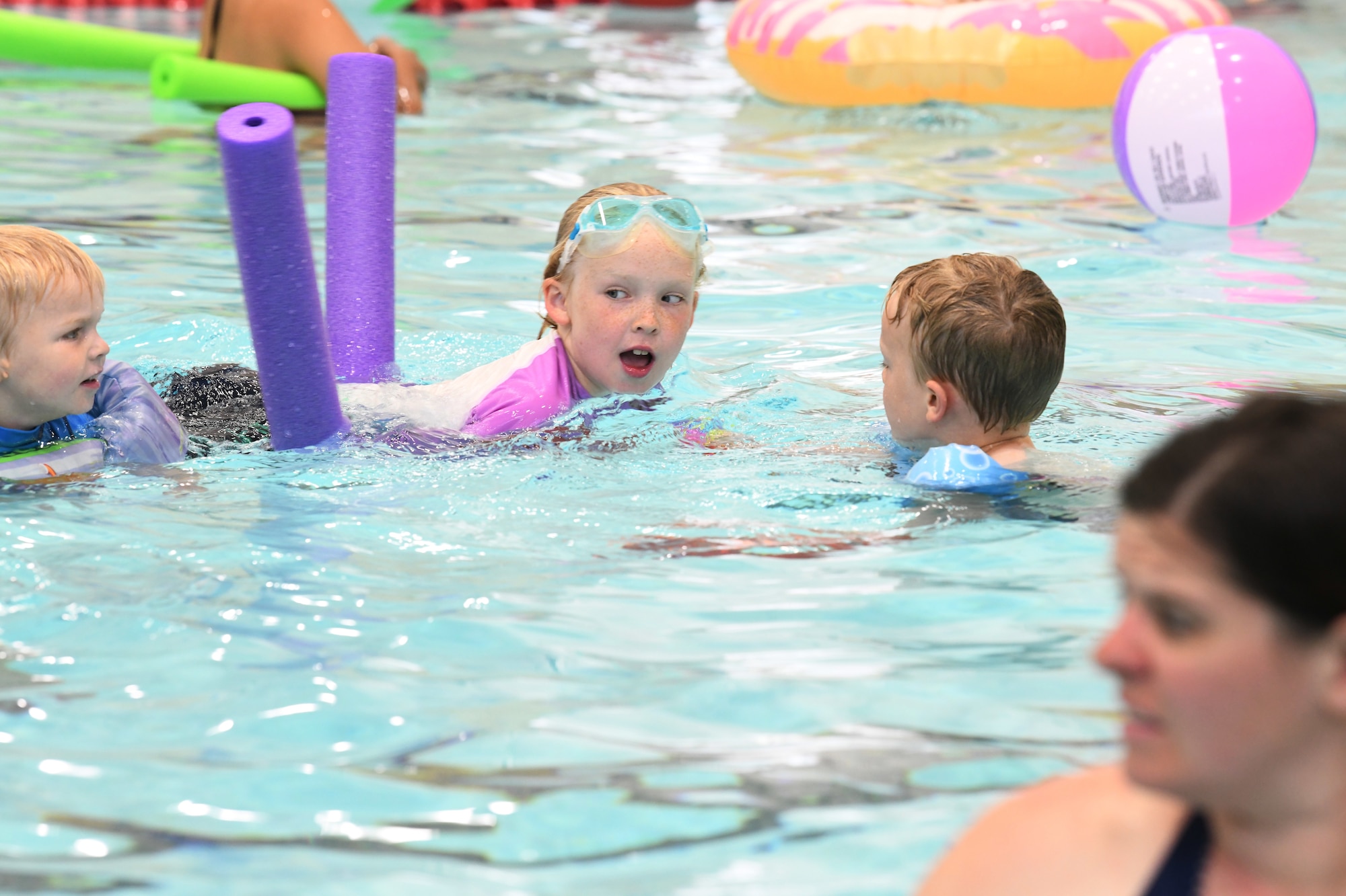 A child swims at the Summer Splash event at Ellsworth Air Force Base, S.D., July 1, 2019. The 28th Force Support Squadron hosted a pool party at the Bellamy Fitness Center where participants were able to escape the heat with a dip in the pool. (U.S. Air Force photo by Senior Airman Thomas Karol)