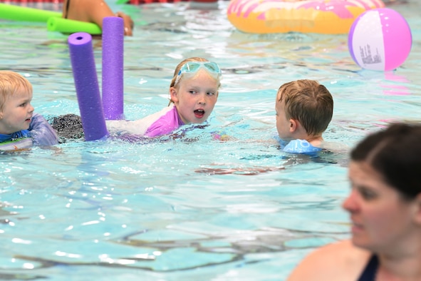 A child swims at the Summer Splash event at Ellsworth Air Force Base, S.D., July 1, 2019. The 28th Force Support Squadron hosted a pool party at the Bellamy Fitness Center where participants were able to escape the heat with a dip in the pool. (U.S. Air Force photo by Senior Airman Thomas Karol)