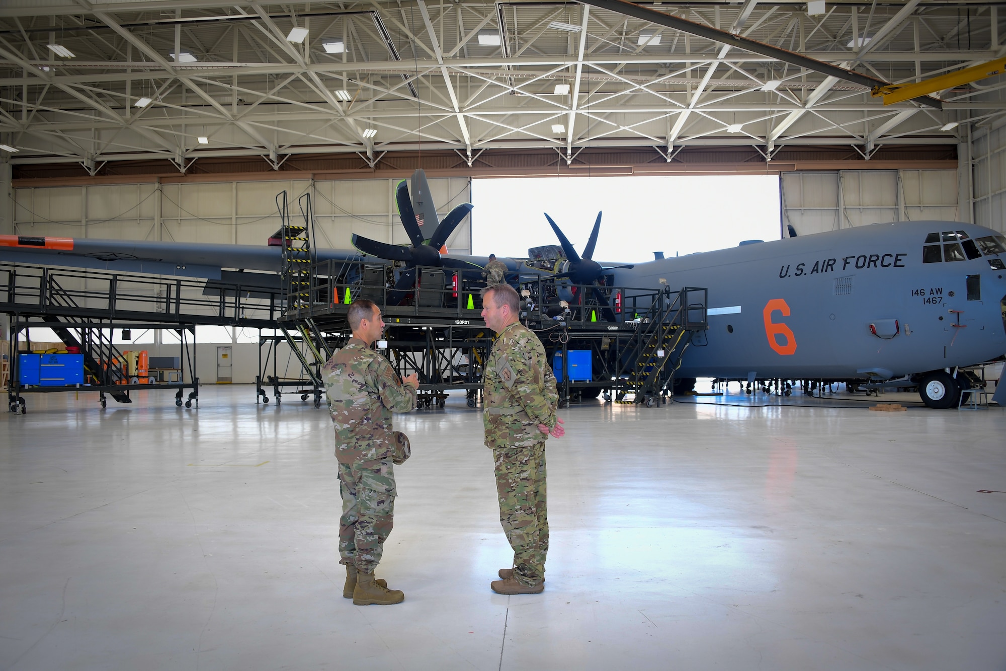 U.S. Air National Guard Maj. Gen. Gregory Jones, Commander California Air National Guard and U.S. Air National Guard Col. John Ramos, Commander 146th Airlift Wing (146AW) Maintenance Group, tour the outside of a C-130J aircraft at the Channel Islands Air National Guard Station, Port Hueneme, CA. June 9, 2019. (U.S. Air National Guard photo by Airman 1st Class Mackenzie Bacalzo)