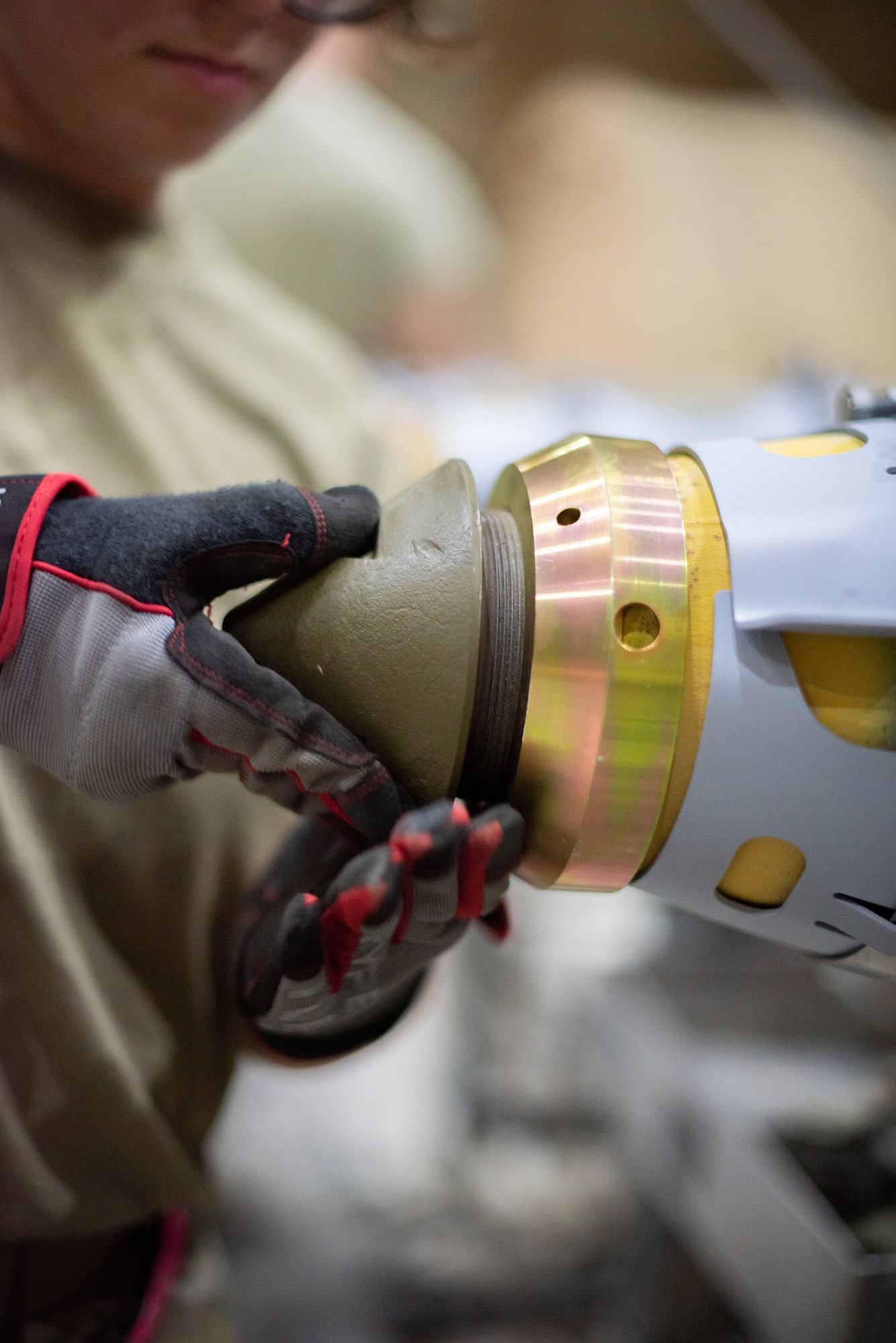Airman 1st Class Ashley Diaz, 380th Expeditionary Maintenance Squadron conventional maintenance technician, attaches a nose cone to a GBU-38 June 21, 2019, at Al Dhafra Air Base, United Arab Emirates.