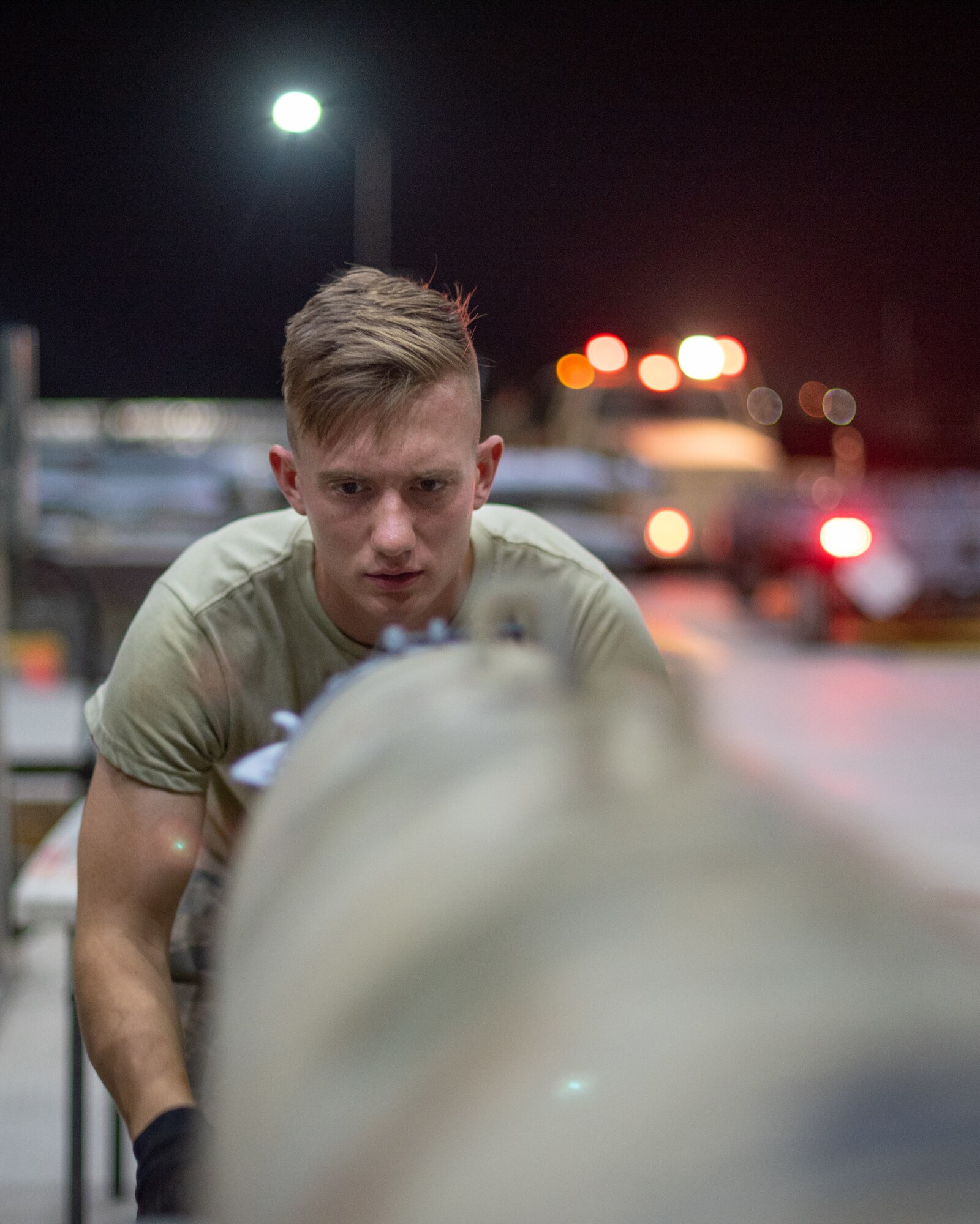 Airman 1st Class John Lininger, 380th Expeditionary Maintenance Squadron conventional maintenance technician, checks the alignment of a GBU-38 strake June 21, 2019, at Al Dhafra Air Base, United Arab Emirates.