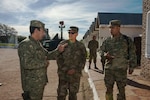 Uruguayan Army Colonel Dyver M. Neme, Communications Brigade One Commander, left, discusses the Uruguayan Army's communications capabilities with Lt. Col. Guy Marino, 103rd Air Control Squadron, center, and Maj. David Ferrer, Connecticut State Partnership Program Director in Montevideo, Uruguay, June 27, 2019.