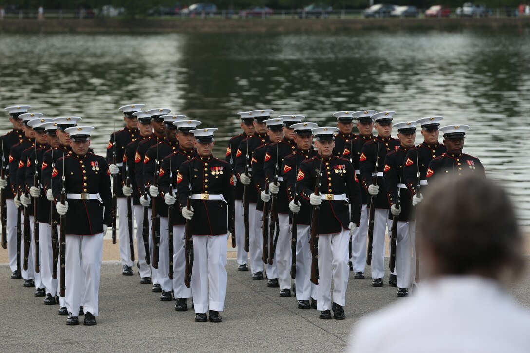 Marines with the U.S. Marine Corps Silent Drill Platoon execute precision drill movements during a Tuesday Sunset Parade at the Thomas Jefferson Memorial, Washington, D.C., July 2, 2019. The hosting official for the evening was Brigadier Gen. Lorna Mahlock, director, Command, Control, Communications and Computers, and the guest of honor was Ms. Sheila Casey, chief operating officer for the Hill and Chair of the Board of Directors for Blue Star Families. (U.S. Marine Corps photo by Sgt. Robert Knapp/Released)