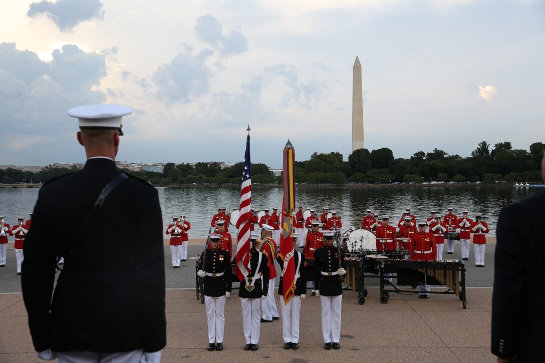 Marines with the U.S. Marine Corps Color Guard present the National Ensign during a Tuesday Sunset Parade at the Thomas Jefferson Memorial, Washington, D.C., July 2, 2019. The hosting official for the evening was Brigadier Gen. Lorna Mahlock, director, Command, Control, Communications and Computers, and the guest of honor was Ms. Sheila Casey, chief operating officer for the Hill and Chair of the Board of Directors for Blue Star Families. (U.S. Marine Corps photo by Sgt. Robert Knapp/Released)