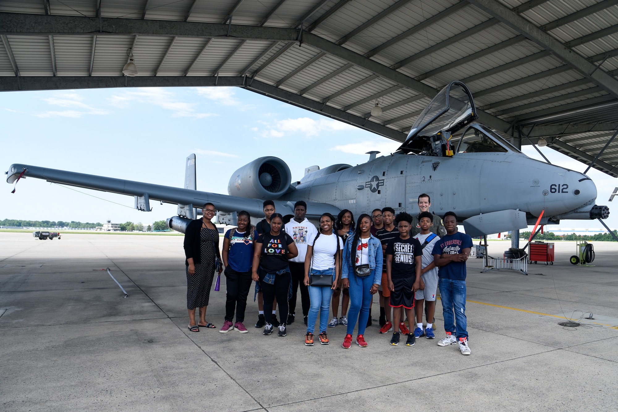Students from the Baltimore City Department of Recreation and Parks Science, Technology, Engineering and Math program pose for a group photo, July 3, 2019, at Martin State Airport, Middle River, Md. The students, ranging from 9th – 12th grade, were introduced to the A-10C Thunderbolt II aircraft and simulator as well as Electro-Optical and Infrared (EOIR) sensors. (U.S. Air National Guard photo by Staff Sgt. Enjoli Saunders)