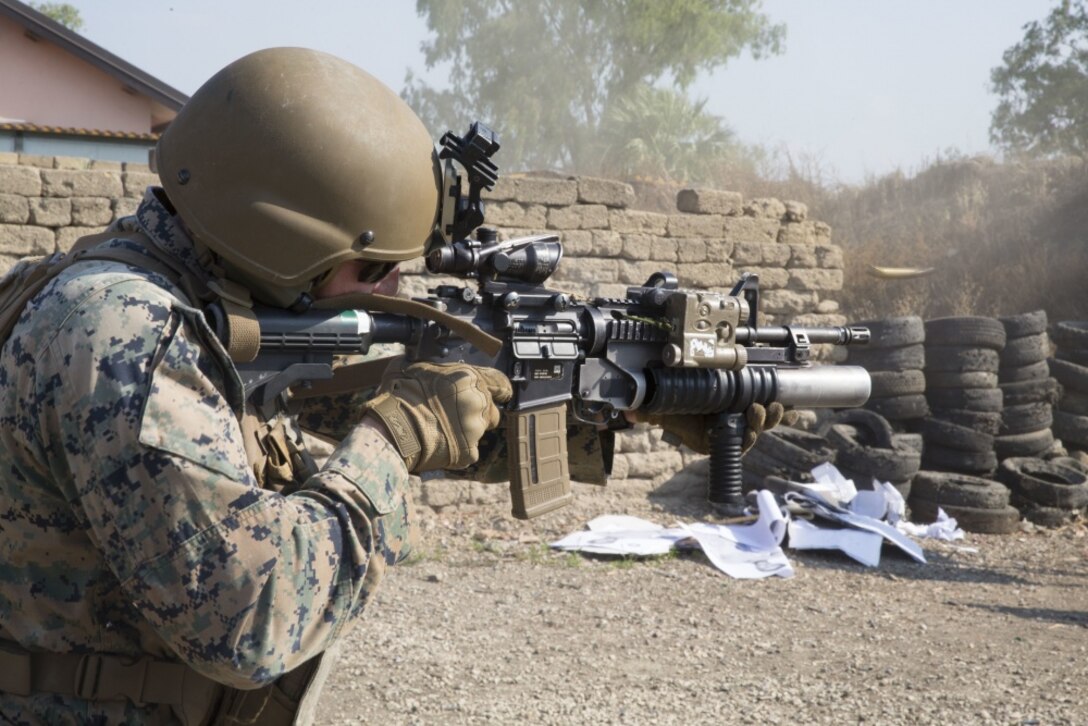 A U.S. Marine fires his M4 carbine at the Etna Range, Catania, Italy, June 28, 2019. SPMAGTF-CR-AF is deployed to conduct crisis-response and theater-security operations in Africa and promote regional stability by conducting military-to-military training exercises throughout Europe and Africa. The Marine is currently deployed supporting Special Purpose Marine Air-Ground Task Force-Crisis Response-Africa 19.2, Marine Forces Europe and Africa. (U.S. Marine Corps photo by Staff Sgt. Mark E. Morrow Jr.)