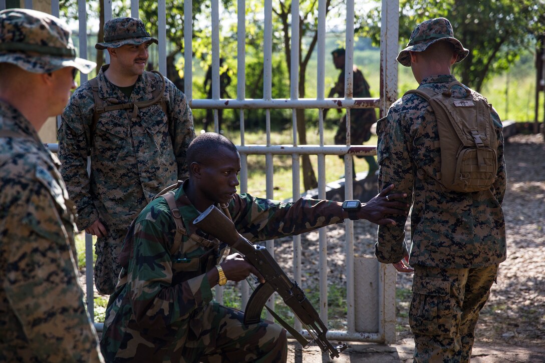 U.S. Marines with Special Purpose Marine Air-Ground Task Force-Crisis Response-Africa 19.2, Marine Forces Europe and Africa, advise members of the Uganda People’s Defence Force on patrolling during a theater security cooperation event at Peace Support Operations Training Center Camp Singo, Uganda, June 12, 2019. The Ugandan soldiers trained alongside the U.S. Marines and learned how to properly conduct reconnaissance and improve their logistics and engineering capabilities. (U.S. Marine Corps photo by Cpl. Margaret Gale)