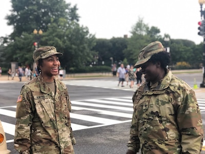 Col. Renee Gore, Joint Task Force Independence commander, District of Columbia National Guard, speaks to a Soldier during the Independence Day celebration July 4th in Washington D.C. Approximately 800 D.C. National Guard members provided support to the D.C. Metropolitan Police and United States Park Police during the Independence Day celebration.