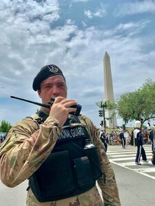 Senior Airman Ryan Hotte, 113th Security Forces Squadron, talks on radio during the festivities on July 4, 2019 in Washington, D.C. Hotte is one of nearly 800 D.C. National Guard members providing support to the D.C.Metropolitan Police and United States Park Police over the holiday.