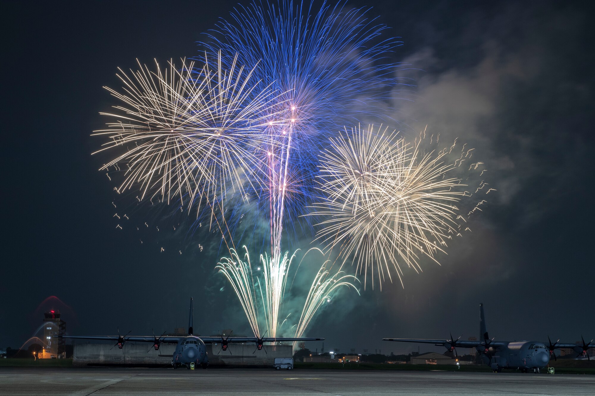 Fireworks behind a C-130J Super Hercules