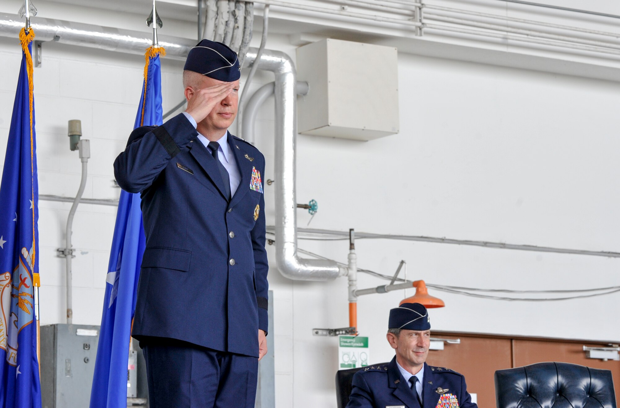 U.S. Air Force Brig. Gen. Joel Carey, 18th Wing commander, salutes Airmen during the 18th Wing change of command ceremony July 8, 2019, at Kadena Air Base, Japan.