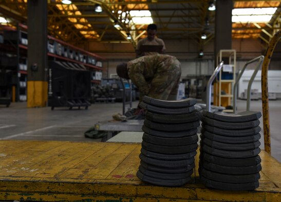 Body armor plates rest on a cart while a 39th Logistic Readiness Squadron Airman inventories a mobility bag June 25, 2019, at Incirlik Air Base, Turkey. The plates are one of the various posture equipment used to enhance Airmen’s protective measures. (U.S. Air Force photo by Staff Sgt. Matthew J. Wisher)
