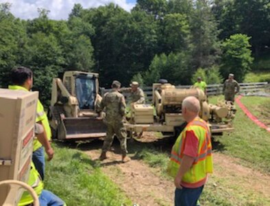 West Virginia Army National Guard Soldiers provide welfare checks, water distribution, and debris removal in and around Harman, West Virginia, July 7, 2019 to assist residents who were affected by flooding June 30, 2019. The Soldiers have distributed 65 cases of water and boxes of food to residents as well as delivered two water buffalos to provide potable water.