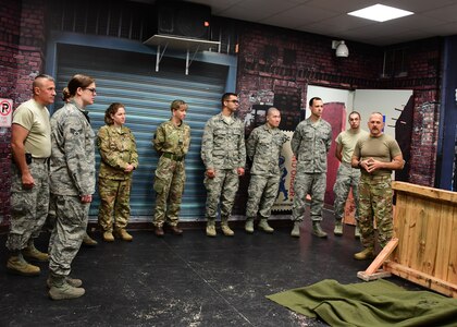 Members of the 911th Airlift Wing and the Royal Air Force Leuchars, Scotland, run through the scenario they will be doing at Fort Indiantown Gap, Pennsylvania, June 18, 2019. During the week at Fort Indiantown Gap the medical personnel learned about tactical combat care and would later use it in the scenario room with mechanical mannequins. (U.S. Air Force photo by Senior Airman Grace Thomson)
