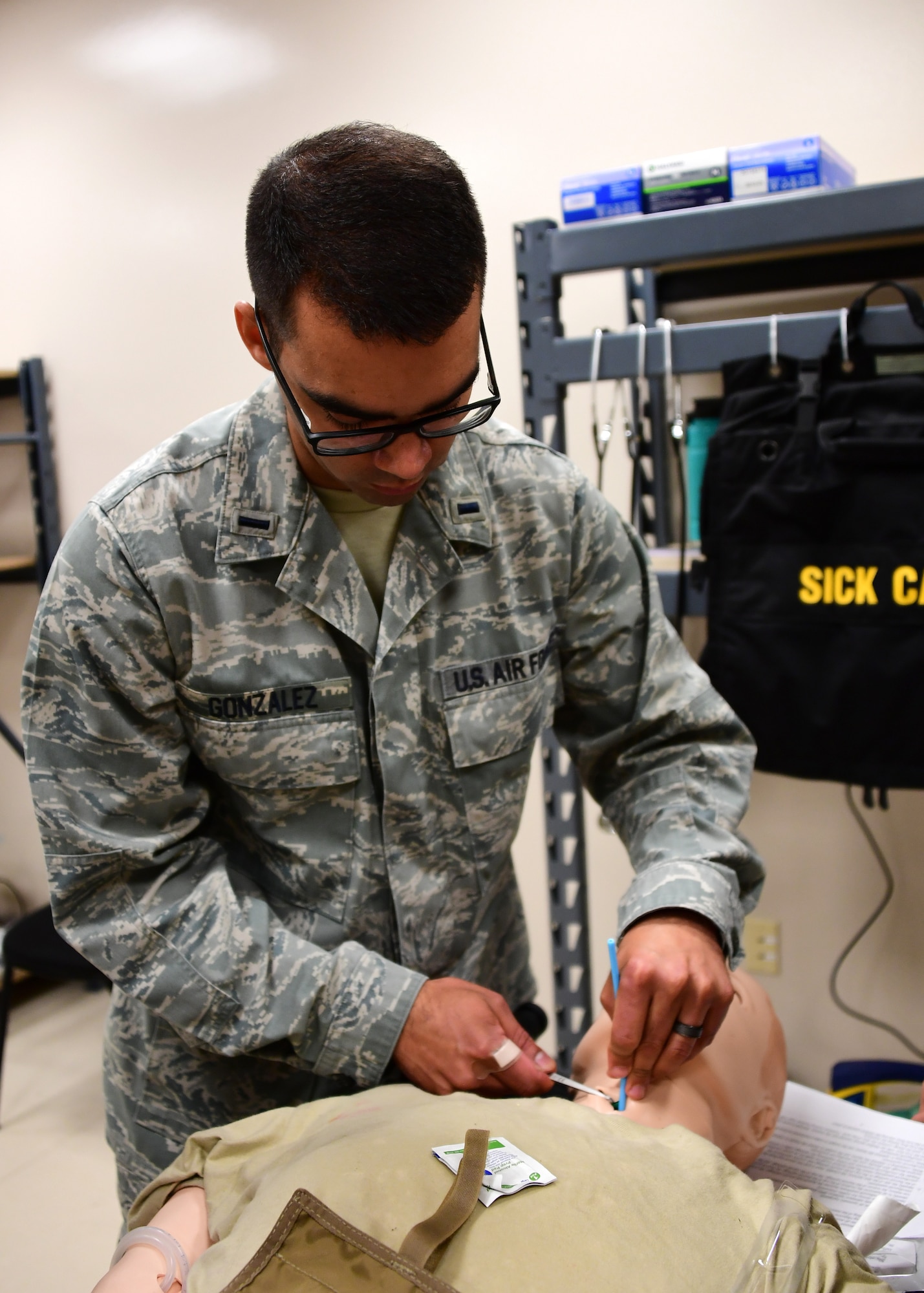 2nd Lt. Damian Gonzalez, flight nurse with the 911th Aeromedical Evacuation Squadron, practices opening an airway through the trachea at Fort Indiantown Gap, Pennsylvania June 19, 2019. This was one of the stations the members of the 911th Airlift Wing had to train at in preparation for their simulation with mechanical mannequins. (U.S. Air Force photo by Senior Airman Grace Thomson)