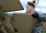 Tech. Sgt. Daniel Johnson, 433th Contingency Response Flight communications specialist, attaches a panel to a Small Package Initial Communications Equipment unit during preparation for exercise Swift Response, June 8, 2019, at Ramstein Air Base, Germany. Exercises like these help prepare our Airmen for potential contingency scenarios. U.S. forces are engaged, postured and ready with credible forces to assure, deter and defend in an increasingly complex security environment.