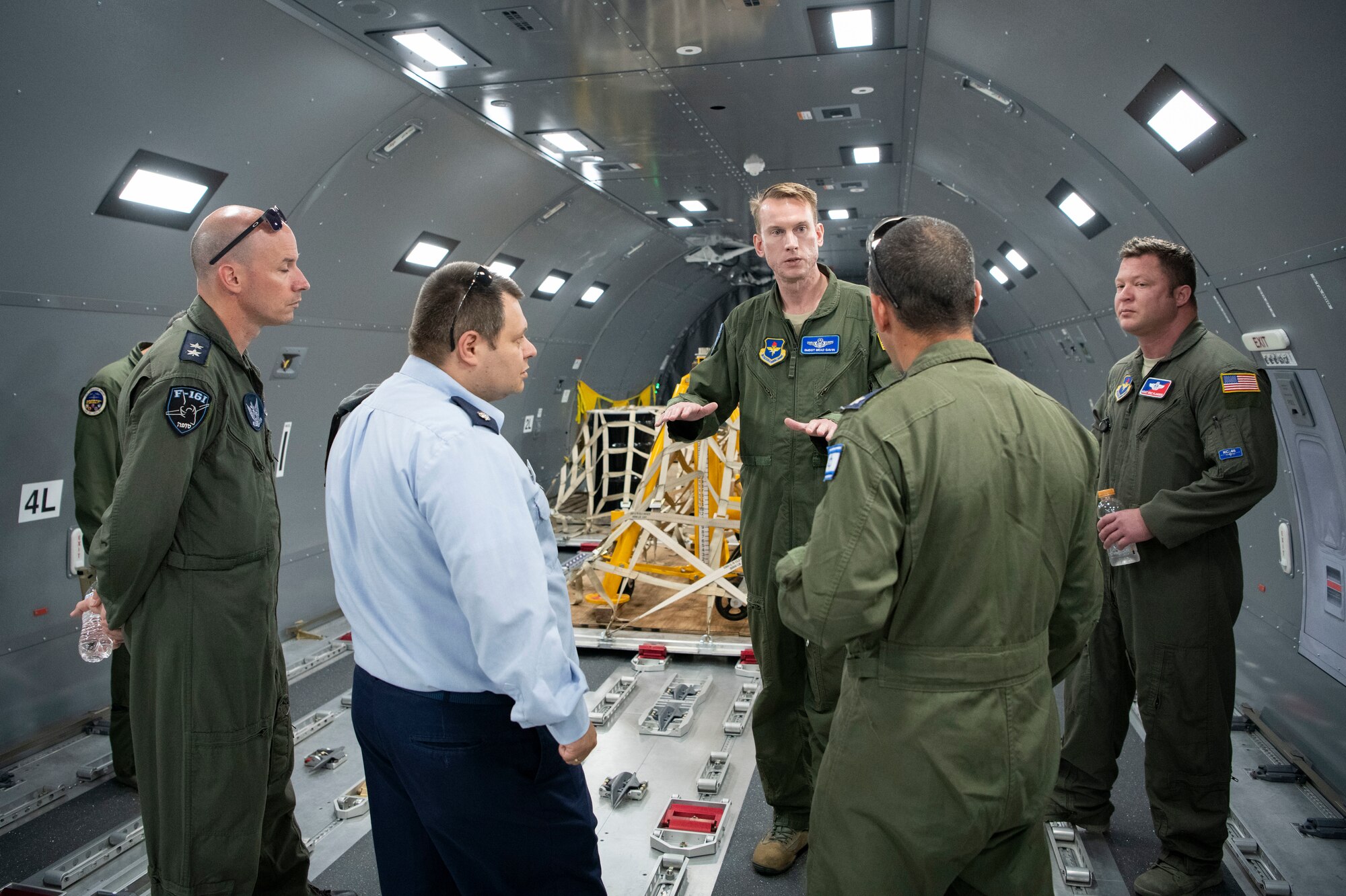 U.S. Air Force Senior Master Sgt. Bradley Gavin, Chief Boom Operator for the KC-46A Pegasus Formal Training Unit, gives members of the Israeli air force Air Attaché to the United States of America a tour of the KC-46A Pegasus Fuselage Trainer, July 1, 2019, at Altus Air Force Base, Okla. The KC-46A is the U.S. Air Force’s newest addition to their tanker fleet and the future of aerial refueling. (U.S. Air Force photo by Airman 1st Class Breanna Klemm)