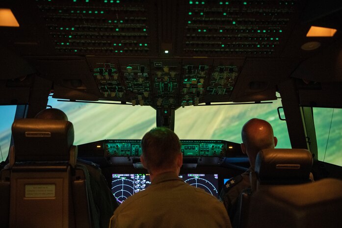 Israeli air force Air Attachés to the United States of America sit inside a KC-46A Pegasus flight simulator, July 1, 2019, at Altus Air Force Base, Okla. The 56th Air Refueling Squadron highlighted the training mission at the 97th Air Mobility Wing to showcase the world-class training and education of our nation's warfighters at Altus AFB. (U.S. Air Force photo by Airman 1st Class Breanna Klemm)
