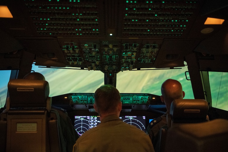 Israeli air force Air Attachés to the United States of America sit inside a KC-46A Pegasus flight simulator, July 1, 2019, at Altus Air Force Base, Okla. The 56th Air Refueling Squadron highlighted the training mission at the 97th Air Mobility Wing to showcase the world-class training and education of our nation's warfighters at Altus AFB. (U.S. Air Force photo by Airman 1st Class Breanna Klemm)