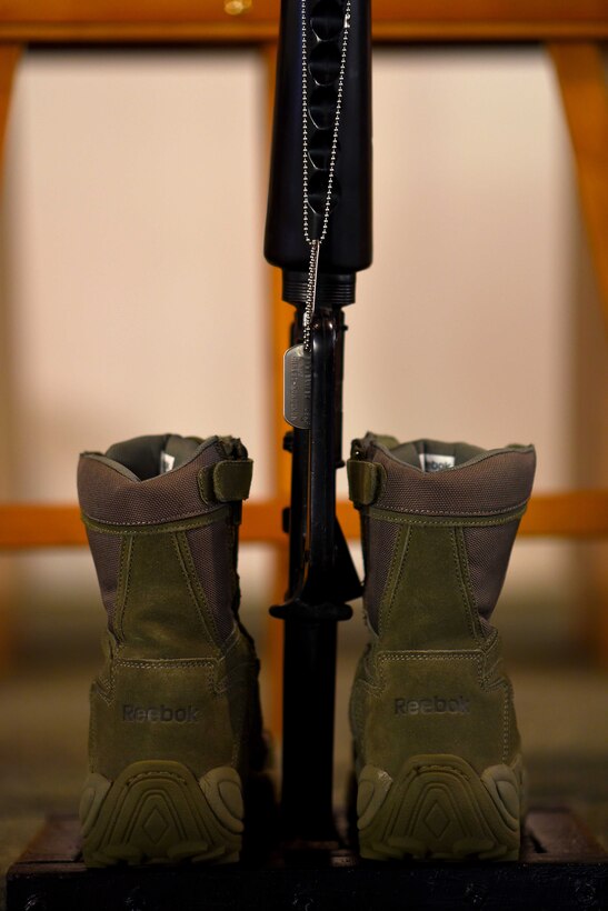 Maj. Stephen Osakue Jr., 14th Medical Support Squadron Pharmacy Flight commander’s boots and dog tags displayed in the Chapel during his memorial ceremony July 27, 2019, on Columbus Air Force Base, Miss. He was a son, brother, husband, father and friend. He is survived by his wife, Rosario Carrillo; son, Jordan; and daughter, Gabrielle. (U.S. Air Force photo by Senior Airman Keith Holcomb)