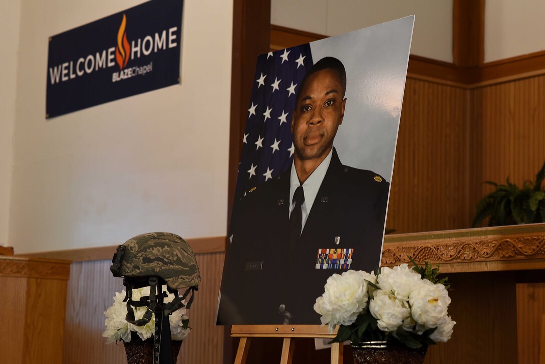 Maj. Stephen Osakue Jr., 14th Medical Support Squadron Pharmacy Flight commander’s photo and memorial display sat at the front of the chapel during his memorial ceremony July 27, 2019, on Columbus Air Force Base, Miss. He is survived by his wife, Rosario Carrillo; son, Jordan; and daughter, Gabrielle. (U.S. Air Force photo by Senior Airman Keith Holcomb)
