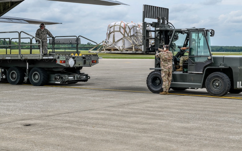 Reserve Citizen Airmen with Youngstown Air Reserve Station, guide humanitarian relief cargo bound for Guatemala onto an aircraft June 19, 2019, on the flightline here.