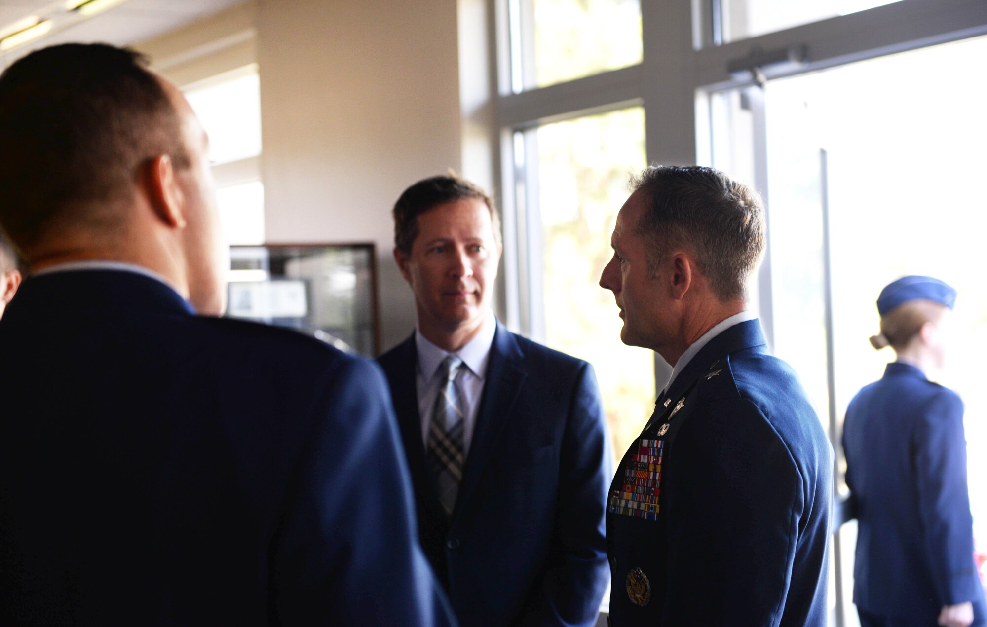 Retired Brig. Gen. John Cherrey, former Director of Intelligence, Operations and Nuclear Integration, Headquarters Air Education and Training Command at Joint Base San Antonio-Randolph, Texas, speaks with Steve Broderick, spouse of Col. Samantha Weeks, 14th Flying Training Wing commander, before Specialized Undergraduate Pilot Training Class’s 19-17/18 graduation in the Kaye Auditorium June 28, 2019, on Columbus Air Force Base, Miss. (U.S. Air Force photo by Airman Hannah Bean)