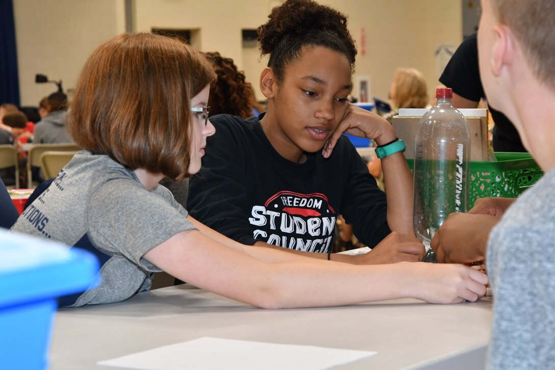 IMAGE: KING GEORGE. Va. (June 26, 2019) – Middle school students prepare for an aerospace engineering rocketry activity at the 2019 Naval Surface Warfare Center Dahlgren Division (NSWCDD) science, technology, engineering, and mathematics (STEM) Summer Academy, held June 24-28. They were among 70 middle school students who constructed and calibrated their water rockets while discovering the optimal amount of fuel (water) to launch a ball the highest. The STEM Summer ‘campers’ worked in teams to organize and analyze their data in order to determine what fuel volume will result in the highest launch.