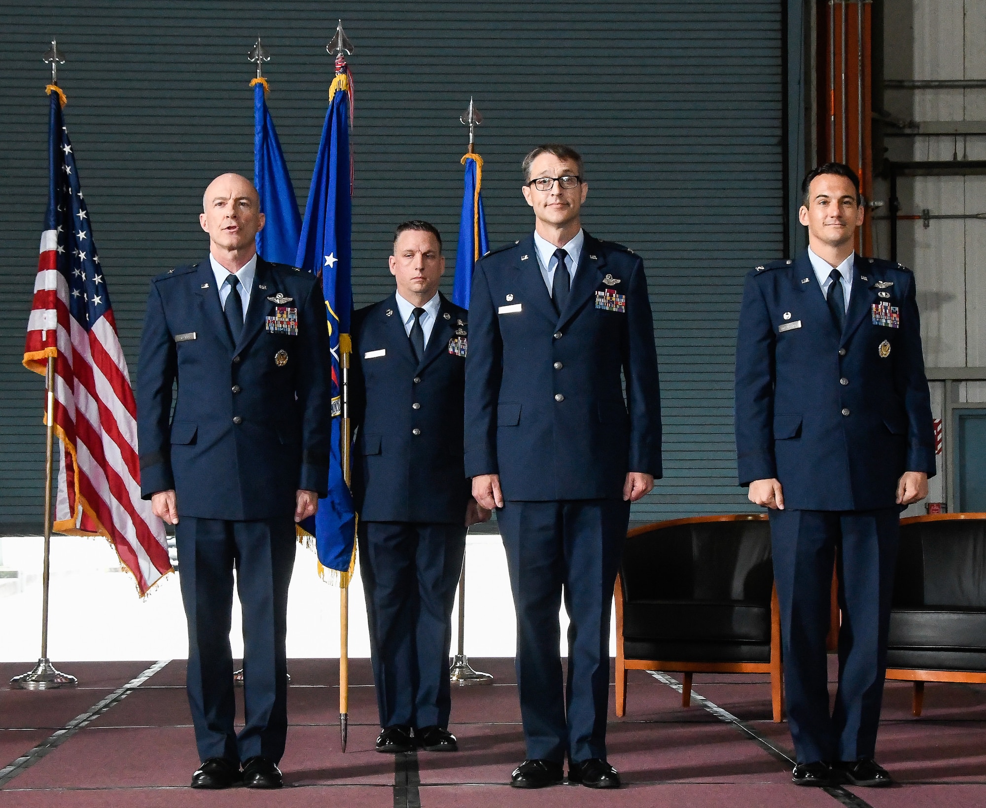 Air Force Test Center Commander, Brig. Gen. Christopher Azzano, left, commands the Change of Command Order be published during the AEDC Change of Command Ceremony June 18 at the Large Rocket Motor Test Facility J-6 on Arnold Air Force Base. Also pictured from left are AEDC Superintendent Chief Master Sgt. Robert Heckman, outgoing AEDC Commander Col. Scott Cain and incoming AEDC Commander Col. Jeffrey Geraghty. (U.S. Air Force photo by Jill Pickett)