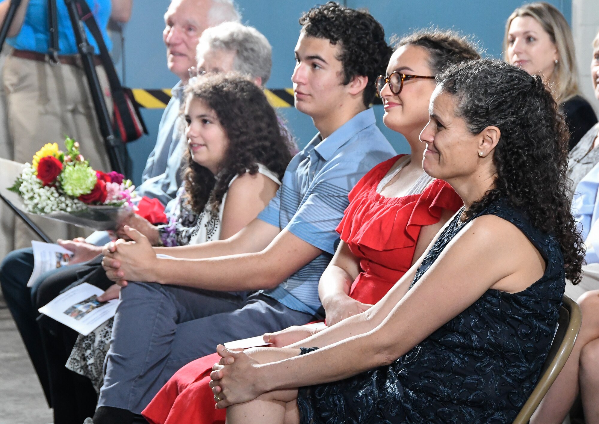 Members of Col. Jeffrey Geraghty's family listen as he speaks in praise of them after taking command of AEDC during a Change of Command Ceremony June 18 at the Large Rocket Motor Test Facility J-6 on Arnold Air Force Base. (U.S. Air Force photo by Jill Pickett)