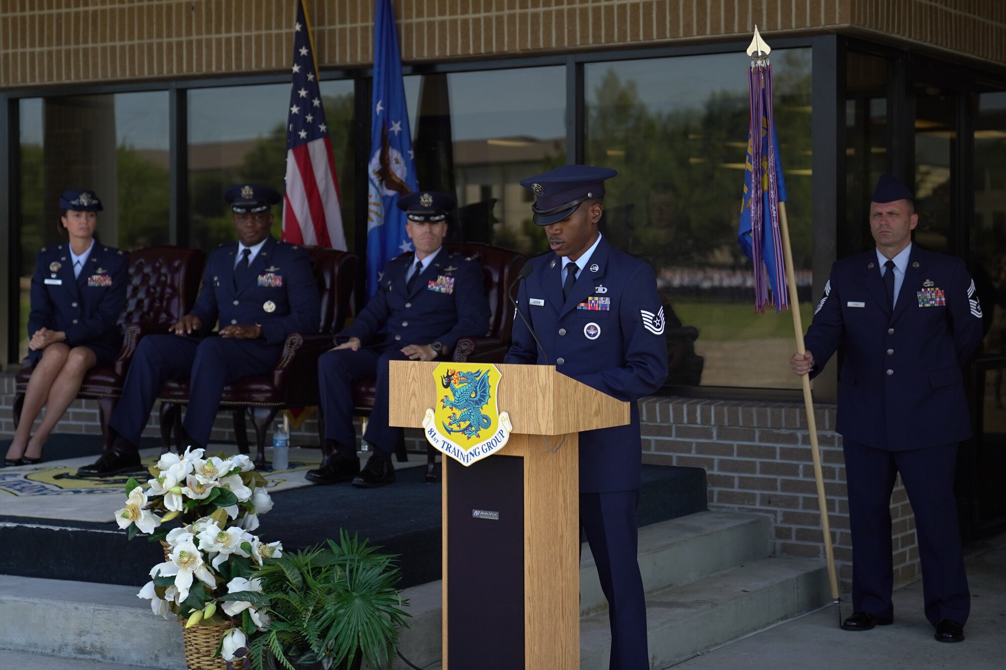 U.S Air Force Tech. Sgt. Marcus Jackson, 334th Training Squadron instructor, speaks during the 81st Training Group change of command ceremony at the Levitow Training Support Facility drill pad on Keesler Air Force Base, Mississippi, July 1, 2019. The ceremony is a symbol of command being exchanged from one commander to the next by the handing-off of a ceremonial guidon. (U.S. Air Force photo by Airman 1st Class Kimberly L. Mueller)