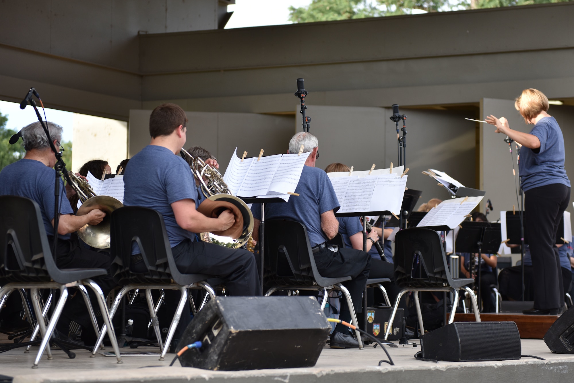 Community Band Director Constance Kelley conducts band members during the opening of the 32nd annual San Angelo Symphony Pops Concert at the Bill Aylor Sr. Memorial River Stage in San Angelo, Texas, July 3, 2019. The Community Band kicked off the concert before the San Angelo Symphony played a variety of patriotic songs building to the finale of “Stars and Stripes Forever” at sundown. (U.S. Air Force photo by Senior Airman Seraiah Wolf/Released)