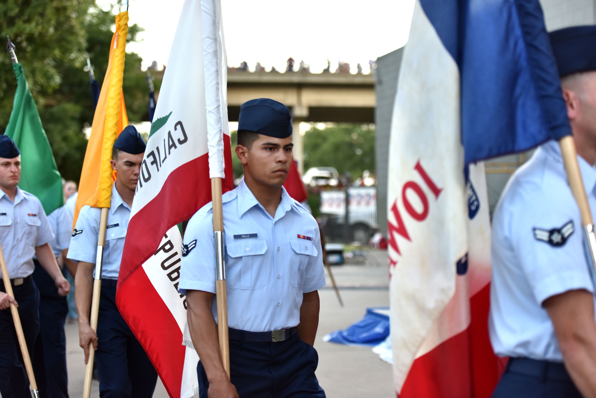Goodfellow service members carry state flags representing the 50 states during the 32nd annual San Angelo Symphony Pops Concert at the Bill Aylor Sr. Memorial River Stage in San Angelo, Texas, July 3, 2019. The free concert was held as an early celebration of Independence Day. (U.S. Air Force photo by Senior Airman Seraiah Wolf/Released)