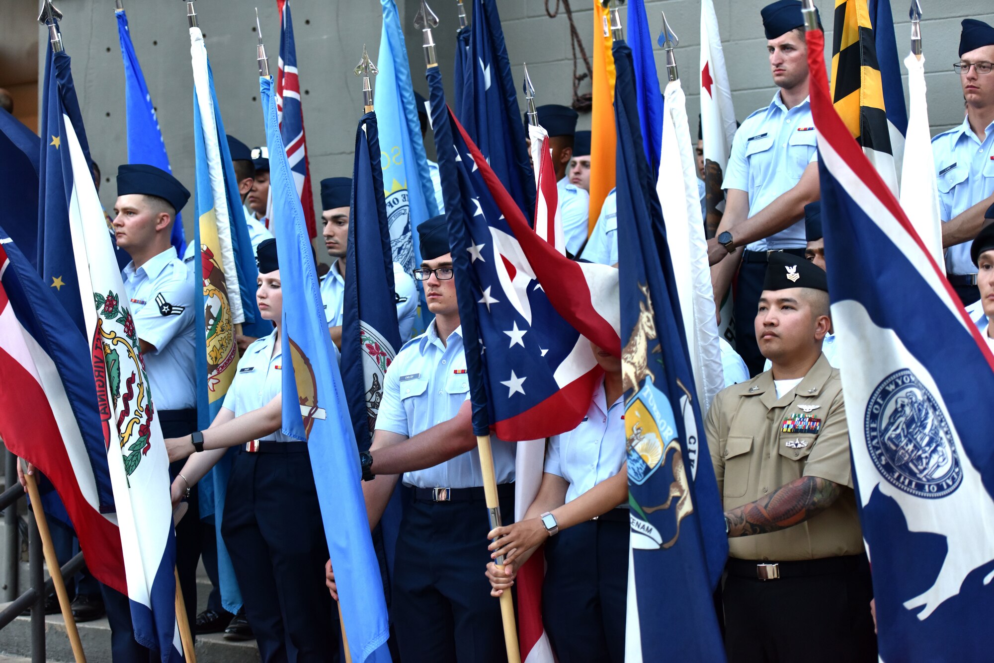 Goodfellow service members present arms during the 32nd annual San Angelo Symphony Pops Concert at the Bill Aylor Sr. Memorial River Stage in San Angelo, Texas, July 3, 2019. The Pops Concert is a concert put on by the San Angelo Symphony to celebrate the independence of America and strengthen San Angelo and Goodfellow relations. (U.S. Air Force photo by Senior Airman Seraiah Wolf/Released)