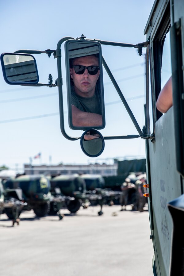 U.S. Marine Corps Lance Cpl. Tyre Reynolds, a motor vehicle operator with Marine Wing Support Squadron (MWSS) 372, Marine Wing Support Group (MWSG) 37, 3rd Marine Aircraft Wing (MAW), removes a winch from a trailer during a Logistics Vehicle System Replacement (LVSR) MKR-16 tractor and M870A2 trailer licensing course at the 25 area motor pool, Marine Corps Base Camp Pendleton, California, July 2, 2019. MWSS-372 is responsible for providing vehicular transportation and support to the various units housed at Marine Corps Air Station Camp Pendleton. (U.S. Marine Corps photo by Cpl. Dylan Chagnon)