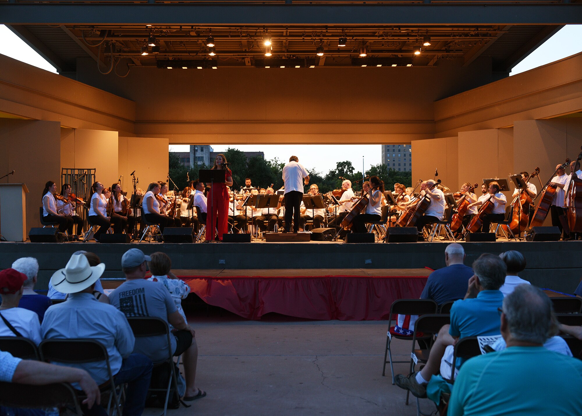 The San Angelo Symphony performs during the annual San Angelo Pops Concert at the Bill Aylor Sr. Memorial River Stage in San Angelo, Texas, July 3, 2019. The concert is an annual Independence Day celebration meant to honor the history of America and strengthen relations between San Angelo and the Goodfellow Air Force Base community. (U.S. Air Force photo by Staff Sgt. Chad Warren/Released)