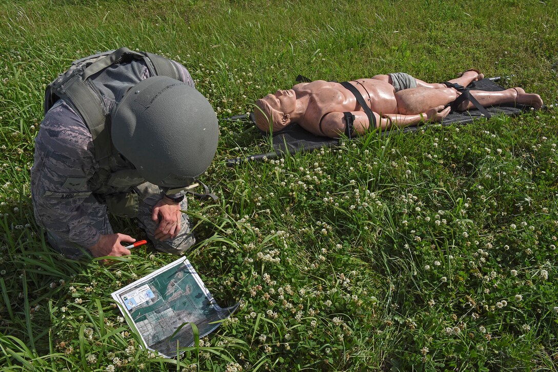 Airman 1st Class Cornelis Mol, 8th Security Forces Squadron 2019 Advanced Combat Skills Assessment team member, practices land navigation techniques at Kunsan Air Base, Republic of Korea, June 4, 2019. The month-long training prepared the five-person team for the ACSA competition and it also sharpened their real-world tactical knowledge, essential for every security forces members deployed or stationed overseas. (U.S. Air Force photo by Staff Sgt. Mackenzie Mendez)