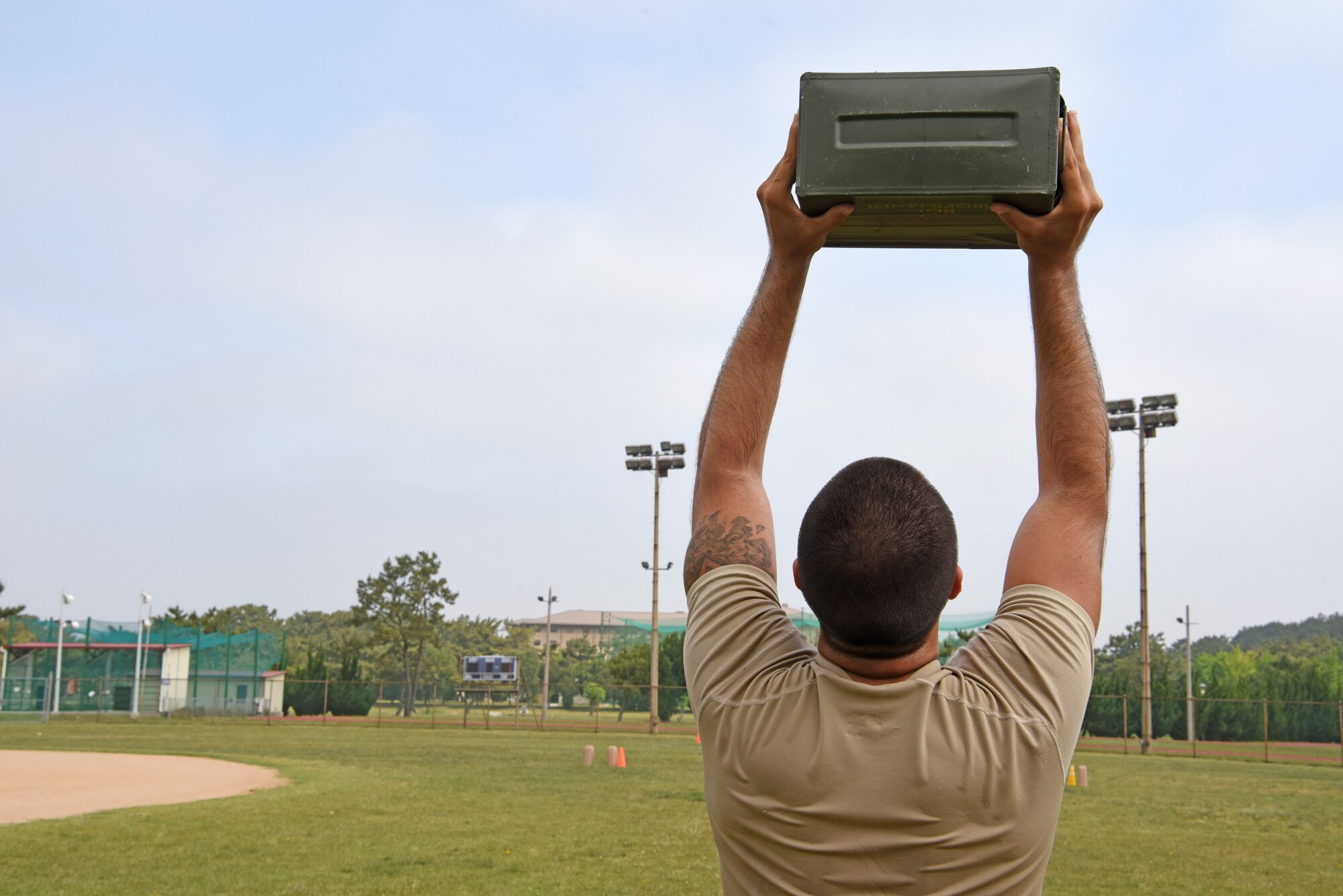 Staff Sgt. Richard Gardner, 8th Security Forces Squadron 2019 Advanced Combat Skills Assessment team member, lifts an ammo can during physical training at Kunsan Air Base, Republic of Korea, June 5, 2019. Team Kunsan not only brought home the top team trophy, they also placed first in three of the five events, including the mental and physical challenge, combat weapons and the combat fitness challenge. (U.S. Air Force photo by Staff Sgt. Mackenzie Mendez)