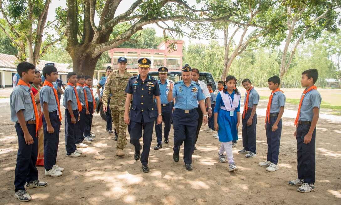 Leaders from Pacific Angel 19-1 and the Bangladesh Air Force celebrate the beginning of Pacific Angel 19-1 at Kazir Chowra Bilateral High School in Lalmonirhat, Bangladesh, June 23, 2019. Pacific Angel 2019 is a joint and combined humanitarian assistance engagement, enhancing participating nations’ humanitarian assistance and disaster relief capabilities while providing beneficial services to people in need throughout South and Southeast Asia. (U.S. Air Force photo by 2nd Lt. Brigitte N. Brantley)
