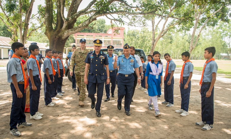 Leaders from Pacific Angel 19-1 and the Bangladesh Air Force celebrate the beginning of Pacific Angel 19-1 at Kazir Chowra Bilateral High School in Lalmonirhat, Bangladesh, June 23, 2019. Pacific Angel 2019 is a joint and combined humanitarian assistance engagement, enhancing participating nations’ humanitarian assistance and disaster relief capabilities while providing beneficial services to people in need throughout South and Southeast Asia. (U.S. Air Force photo by 2nd Lt. Brigitte N. Brantley)