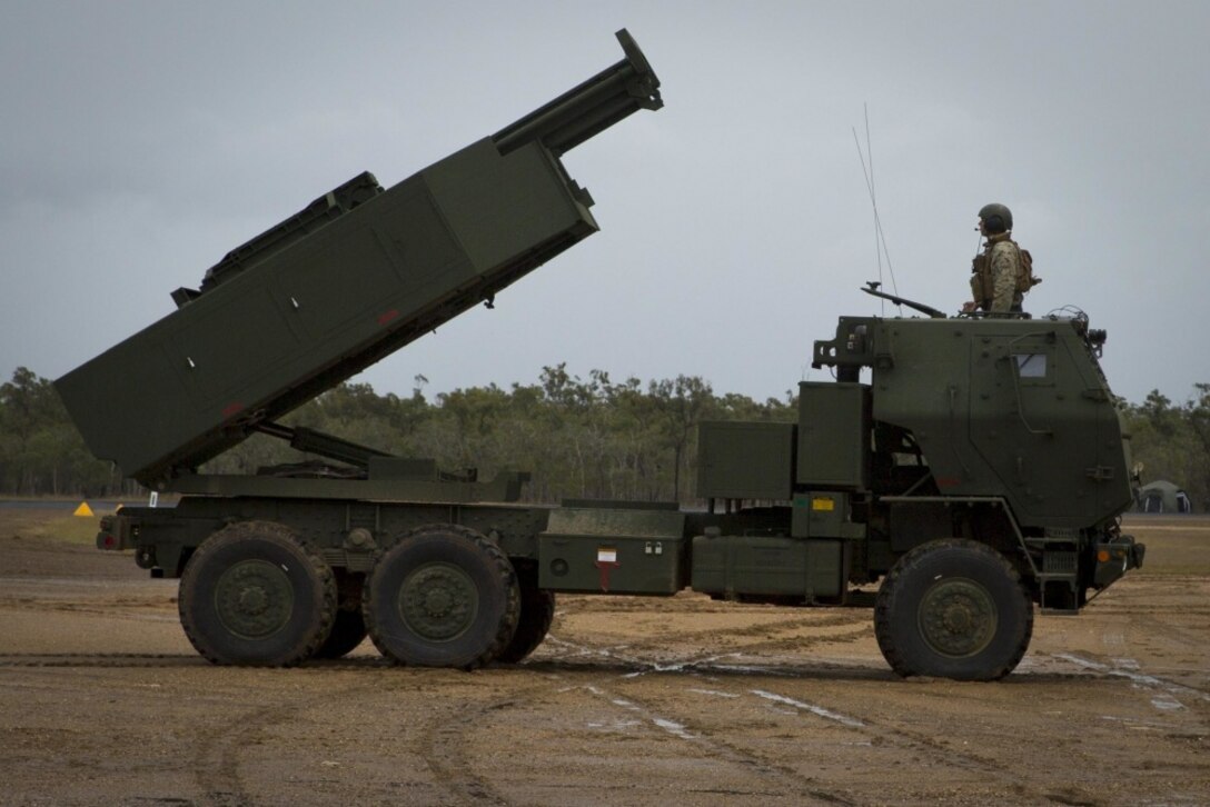 U.S. Marines assigned to 3rd Marine Division simulate preparing a High Mobility Artillery Rocket System (HIMARS) to fire during Exercise Talisman Saber 19 at Shoalwater Bay Training Area, July 6, 2019. In HIRAIN missions, HIMARS are flown in C-130s to an area, unloaded to rapidly conduct a fire missions, then reloaded in and relocated to follow on objectives. (U.S. Marine Corps photo by Lance Cpl. Kaleb Martin)